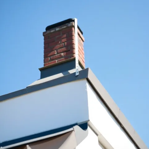 Ile powinien wystawać komin ponad dach płaski